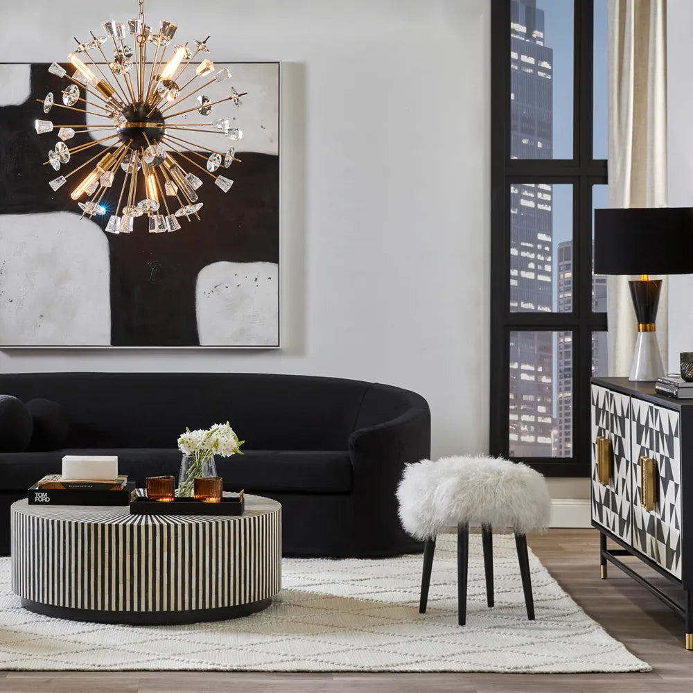 Modern living room featuring oversized abstract wall art above a neutral sofa, demonstrating ideal artwork proportions for interior design